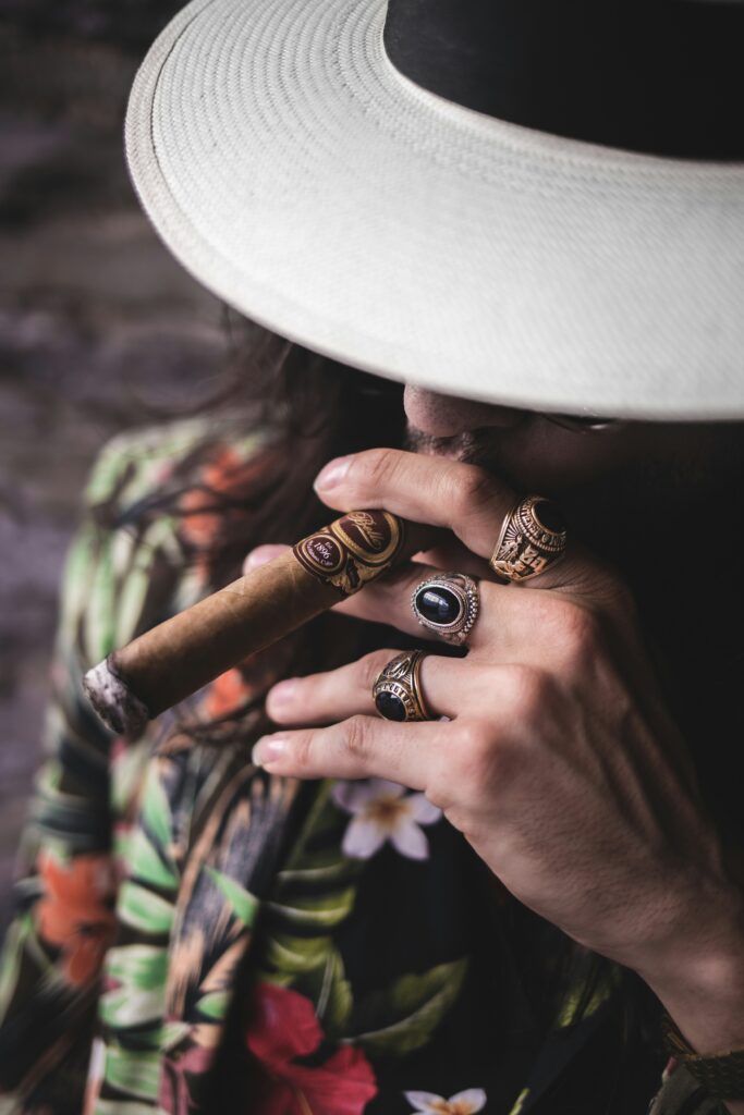 man in fedora smoking cigar